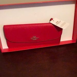 Coach Wallet, hold 12 credit card, cash section, zip change compartment in back